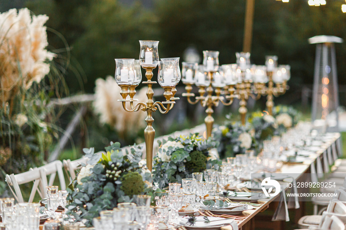 Wedding table set up in boho style with pampas grass and greenery