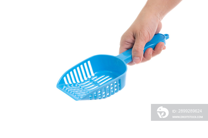 Woman’s hand holding Blue cat litter scoop on white background isolated