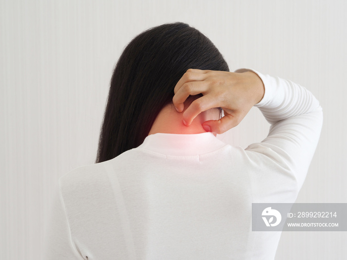 cervical spondylitis, osteomyelitis and fibromyalgia in asian woman. She use hand touching neck back on isolated white background use for health care concept.