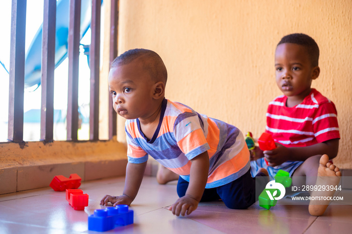 young boys playing creative toy blocks for homeschooling