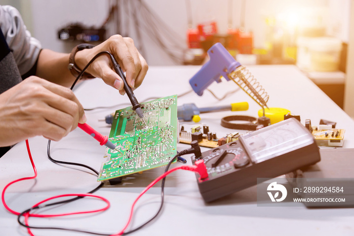 Close up of the hand men hold tool repairs electronics manufacturing Services,Repair of electronic devices, tin soldering parts.