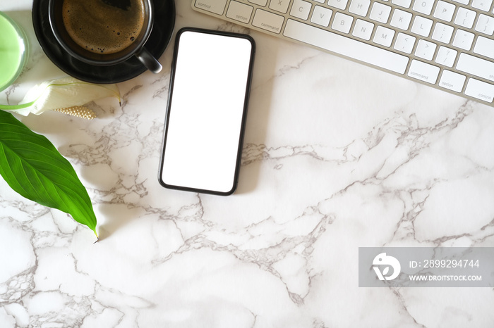 Mock up blank screen mobile phone on marble office desk