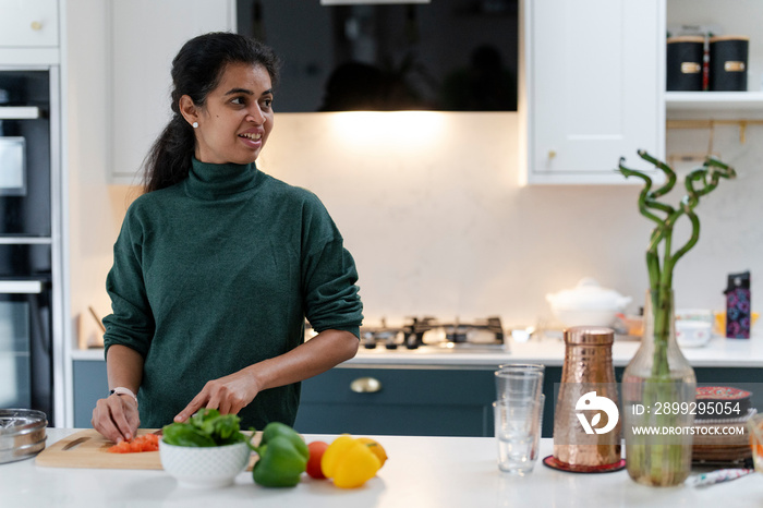 Woman preparing food in kitchen