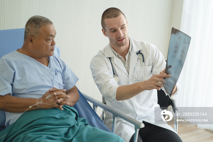 Doctor showing result of radiography to patient and giving diagnosis.