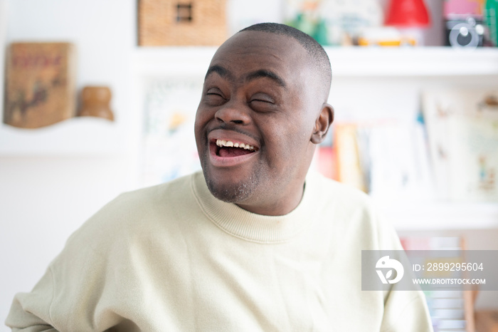 Smiling man with Down syndrome