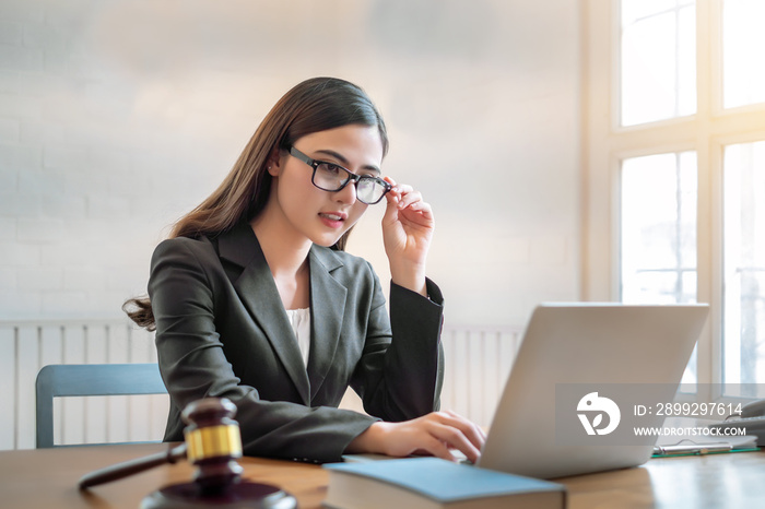 beautiful young asian lawyer woman sitting working in the office.