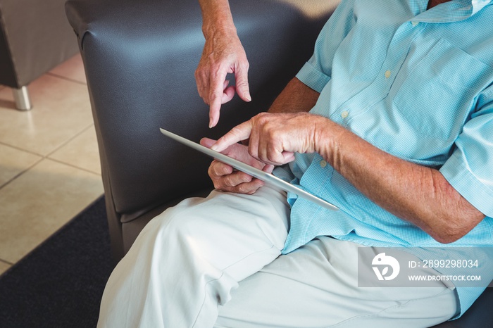 Senior man using a digital tablet