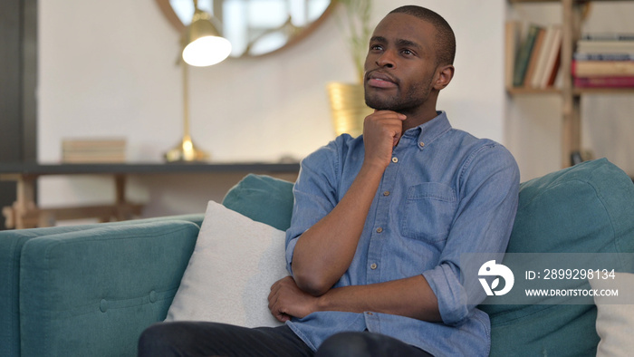 Worried Young African Man Thinking About Problems