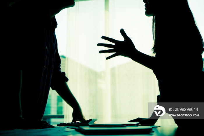 Silhouette Asian couple is fighting by the windows