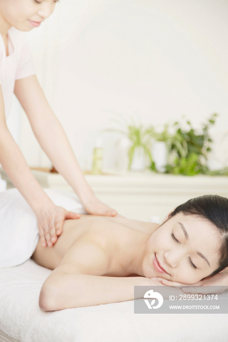 Woman having back massage