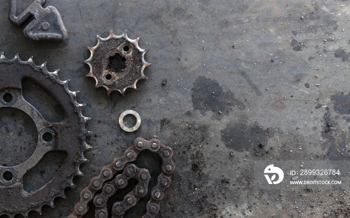 roller chains with sprockets for motorcycles on old black  background. top view