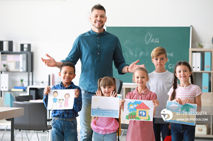 Cute children with teacher in classroom