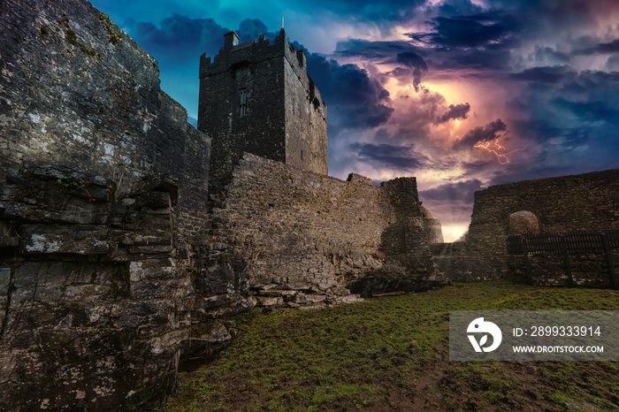 An ancient old castle in Ireland with a storm and lightning landscape