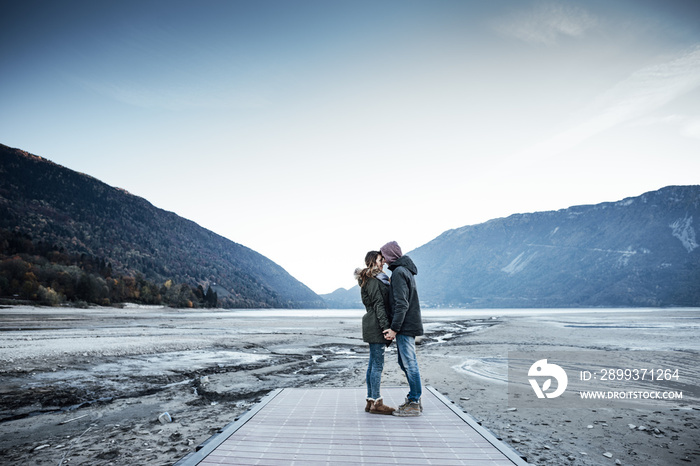 Romantic young couple on a pier