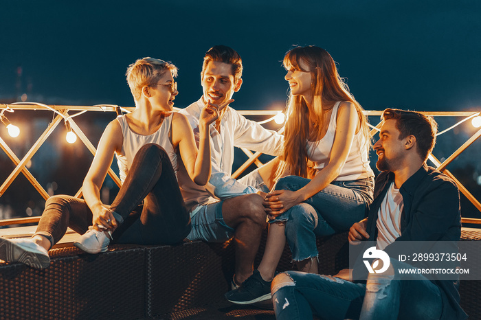 Group of friends enjoying outdoors at roof