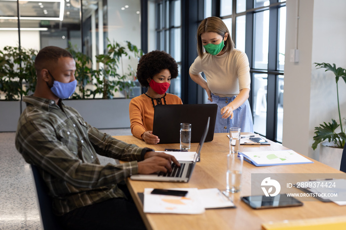 Diverse group of business people working in creative office