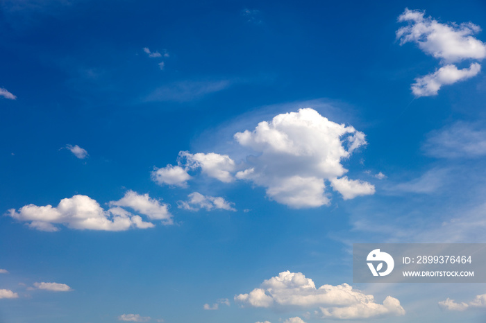 White, fluffy clouds in blue sky