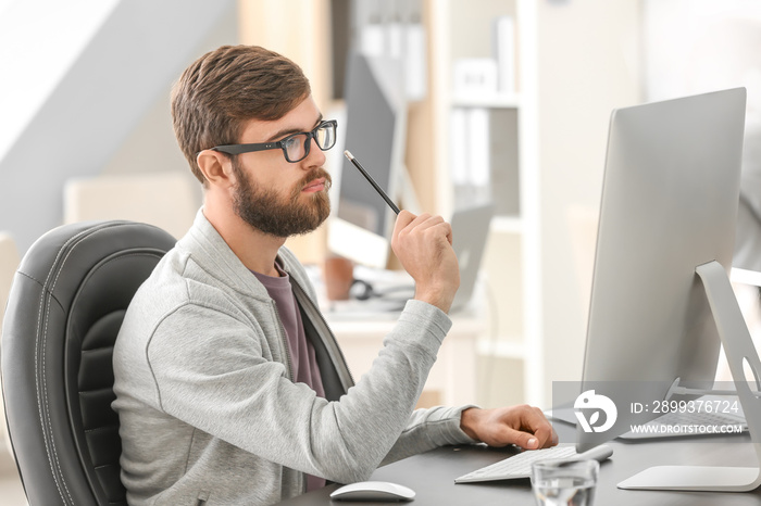 Manager working with computer in office