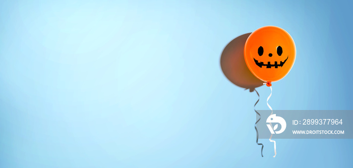 Halloween balloon ghost with happy face - flat lay