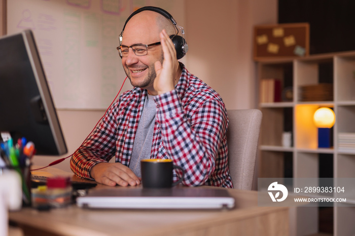 Man working from home having conference call