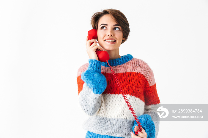 Happy cheerful girl wearing sweater standing