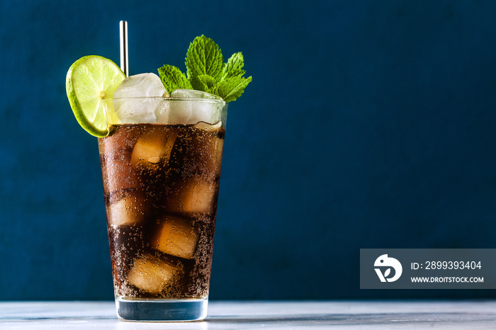 Coca Coke cocktail in a tall glass cuba libre. refreshing summer drink