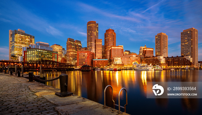 Boston harbor with cityscape and skyline on sunset