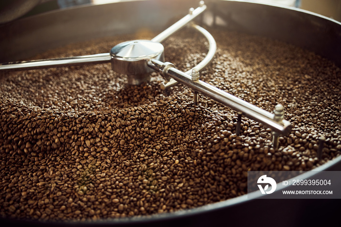 Cooling tray with brown roasted coffee beans