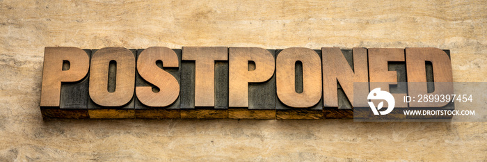 postponed word abstract in wood type