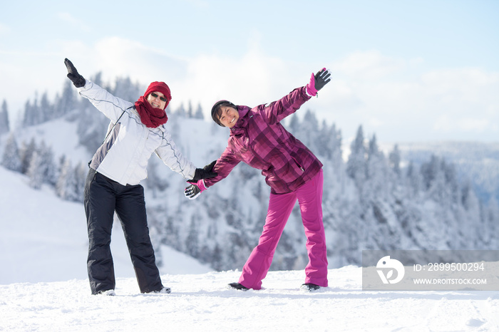 People enjoying winter holiday in ski resort