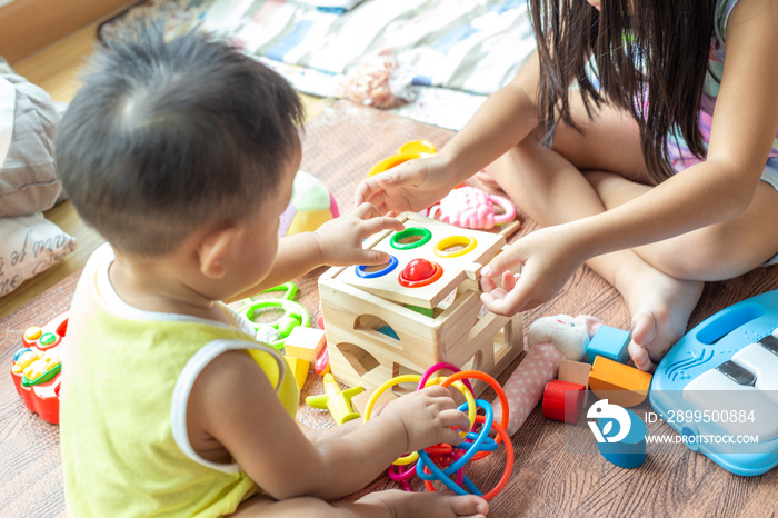 Group of baby friend playing toy together in living home