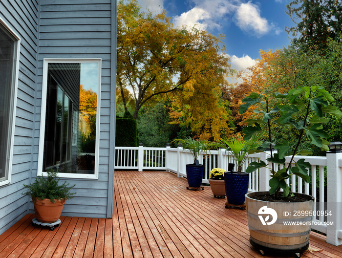 Home cedar wood deck during autumn season