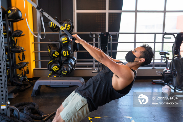 person using resistance bands in the gym