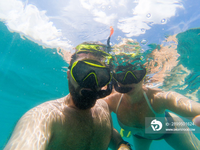 Caucasian couple snorkling