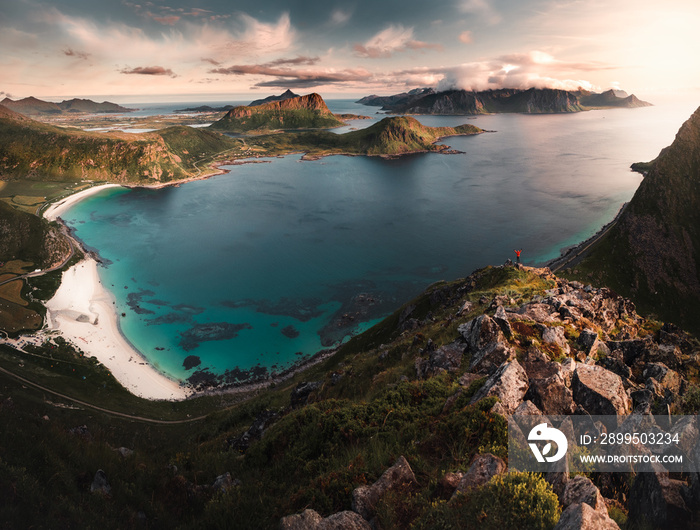 panoramic view of Lofoten Islands. man in the mountain surrounded by sea. Haukland beach from mannen