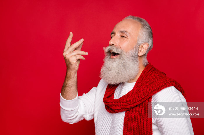 Profile side photo of cheerful retired pensioner showing fingers screaming wearing white sweater isolated over red background