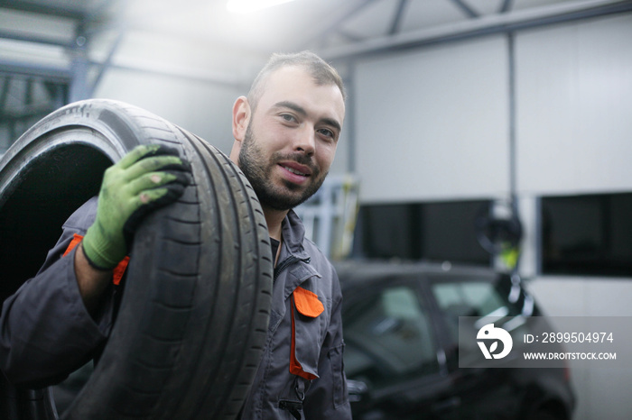 Mechanic working in auto repair shop.