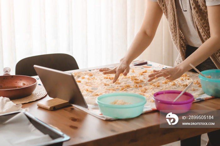 Young woman making pastry with phyllo dough to learn new things is very hungry and Preparing delicious meals with their hands