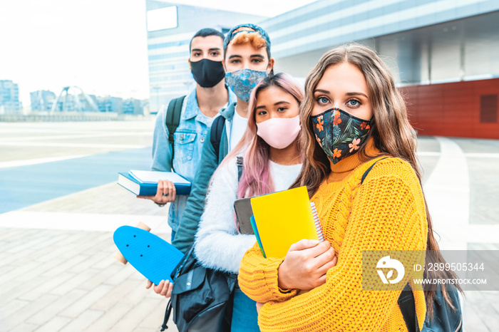 Portrait of a group of students covered by face masks. New normal lifestyle concept with young people going to school at corona virus pandemic.