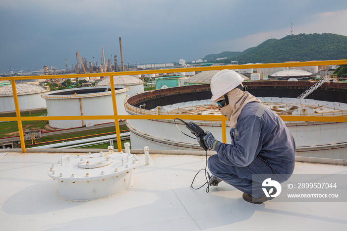 Male worker are for inspection  ultrasonic thickness roof plate top