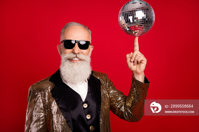 Photo of senior man happy positive smile spin disco ball finger concert showman isolated over red color background