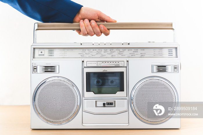 Image of Man Playing an Old Radio Indoors. Close Up of Vintage Radio