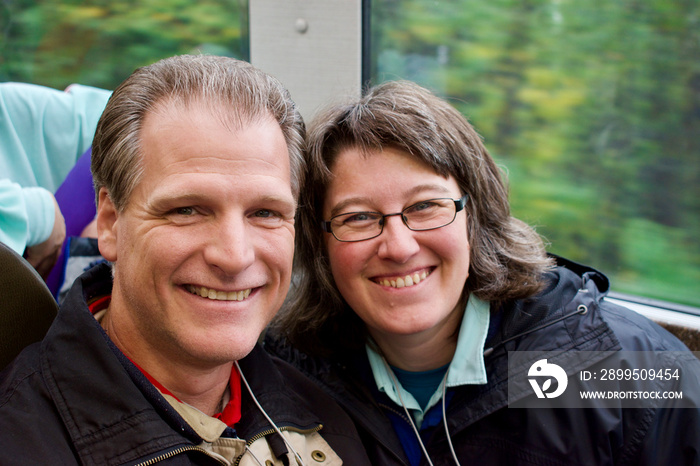 caucasian couple selfie on a train blur background