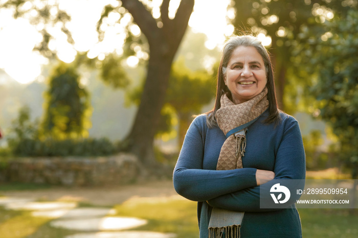 Indian woman in winter wear standing at park