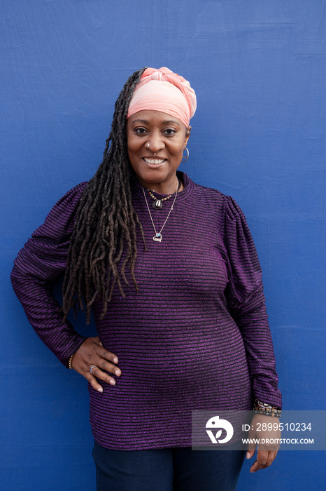 Portrait of beautiful woman with dreadlocks wearing turban