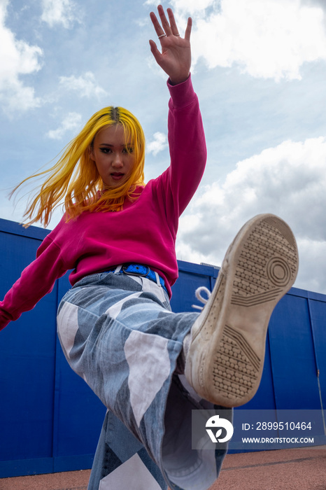 Portrait of young woman with yellow hair