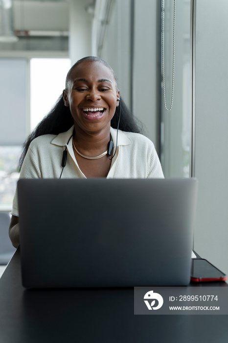 Businesswoman attending video conference in office