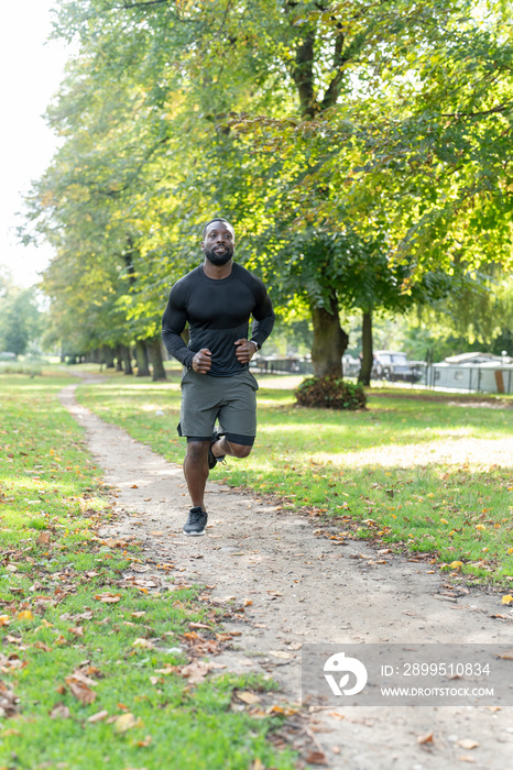 Athletic man jogging in park