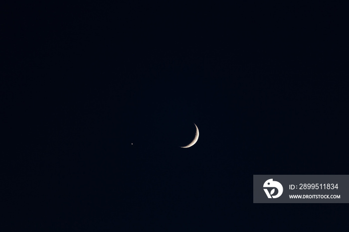 Sliver of moon with star