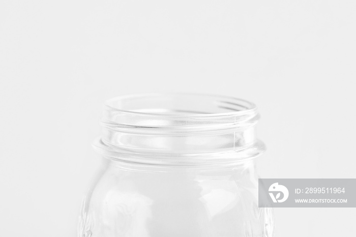 Glassware crystal mason jar on white wall background. Reusable materials plastic-free alternatives zero waste environmental protection food storage concept. Mockup poster with copy space